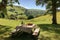 picnic setting with stunning view of rolling hills, babbling brook and warm sunshine