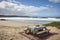 picnic setting with view of the beach, sand and waves in the background