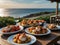 The picnic table is adorned with colorful plates of stuffed lobster tails zesty seafood pasta