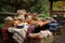 picnic table overflowing with picnic basket goodies, from sandwiches and chips to warm blankets and games