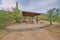 Picnic table with roof near a large saguaro cactus at Tucson, Arizona