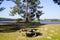 Picnic table sits ready for picnic aside lake in Hostens gironde france