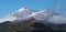 Pico del Teide mountain volcano in snow, bright blue sky