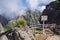 Pico do Arieiro hiking trail, amazing magic landscape with incredible views, rocks and mist, viewpoint with wooden railing