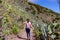 Pico Verde - Rear view on woman on scenic hiking trail near Masca in Teno mountain massif, Tenerife.