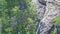 Pictorial high waterfall tagu cascade runs among rocks