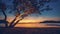 Pictorial sunset reflected in endless sea with sandy beach