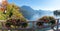 Pictorial tourist destination lake traunsee, bridge to Ort island Gmunden with geranium flowers, austria