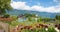 Pictorial tourist resort Iseltwald, view from lakeside promenade, beautiful flowers. Bernese Oberland switzerland