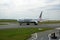 Picture of American Airlines plane on Paris Charles de Gaulle runway and about to take-off for a long journey across the Atlantic.