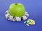 Picture of apple, pills and tape measure