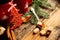 Picture of beautiful Christmas table setting, shining white plate with red cup for coffee decorated holiday dinner, branch of berr