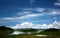 Picture of a beautiful landscape view .There are mountains and lakes Blue sky , white clouds on the day fresh air.