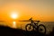 Picture of bicycle on the sunset sea overview