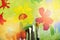 Picture of blossom flowers painted by child. Painting brushes