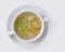 A picture of a bowl of traditional chicken soup served in a bowl over white background