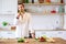 Picture of brunet cooking vegetables on table