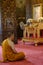 Picture of a buddhist monk meditating in Wat Bovoranives, Bangkok, Thailand.