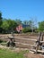 A picture of a cedar rail fence, horse paddock and an old barn
