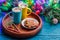 Picture of Christmas cookies, two mugs with cocoa with marshmallow, caramel sticks, branches of spruce