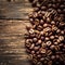 Picture Coffee beans scattered on a rustic wooden background