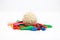 Picture of colorful deflated water balloons and cholai ke ladoo for holi fun