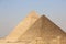 A picture combining four of the great historical pyramids of Giza in the light of day, one of the Seven Wonders of the World, Giza
