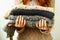 Picture of cozy knitted woolen sweaters in woman`s hands