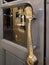 The picture of creative door handle used long handle gold ladle in some restaurant