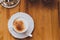 Picture of a cup of coffee with brown sugar on wooden background