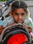Picture of cute Indian little girl setting on bike