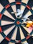 Picture of Darts arrow hitting in the target center of dartboard. concept business goal to marketing success. Business target or