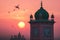 A picture of the dome and a clock tower in a Mosque at sunset or sunrise, the tallest clock tower