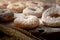 Picture of doughnuts with icing sugar on wooden table