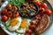 picture of english breakfast with eggs, tomatoes, , bacon, beans, mushrooms and sausage