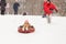 Picture of a father skating daughter on tubing from a snowy slope in a winter day in the parkin winter day