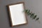 Picture frame mockup for artwork, photo or print presentation with eucalyptus twigs