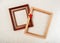 Picture frames with gilding  and red star close-up on white woolen plaid background