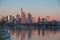 Picture of Frankfurt skyline during sunrise with reflections of skyscraper facades in Main river under cloudless and
