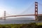 Picture of the Golden Gate Bridge in San Francisco crossing the bay of the Californian city under a blue sky.