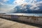 Picture of Greek flag on wall of promenade with stormy sky in Sitia town, Crete island, Greece