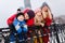 Picture of happy parents with daughter and son on winter walk