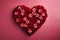 picture of a heart made with dark red and pink roses on a pink background, love is in the air, Valentines theme
