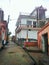 Picture of an Indian village in a street and some houses.