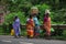 Picture of indian village women walking on street carrying there good for sold