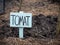 Picture of Just planted tomatoes with wooden sign