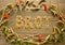 A picture layed with cereals in form of a collar for Thanksgiving inside is the word â€œBrotâ€ german lanuage designed.