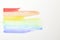 Picture of LGBT rainbow made color smears on white background