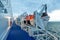 Picture of a lifeboat on board of a vessel on the sea under a cloudy sky