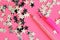 Picture for little schoolgirls. Pink fountain pen on a pink background next to the silver stars. The system of performance and